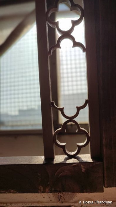 Lattice detail with light behind it.