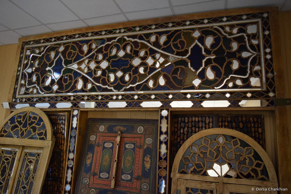 Fieldwork: carved wood and colored-glass panel.